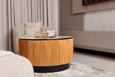 a coffee table in a room with a chair at Closer to Home Luxury Apartments in Midrand