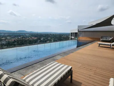 a swimming pool on top of a building at The Regal Studio at The Capital Trilogy in Pretoria