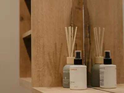 three bottles ofodorizers are sitting on a shelf at Sable Block Self-Catering in Musina