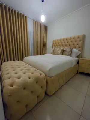 a bedroom with a large bed with a large ottoman at THE BLYDE CRYSTAL LAGOON F&S LUxurious Apartment 3bed in Pretoria