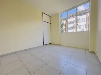 an empty room with a door and a window at Heideland in Pretoria