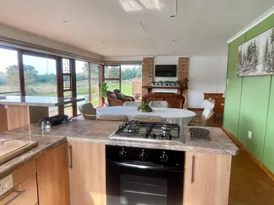 a kitchen with a stove and a counter top at Galil Farm in Crossroads