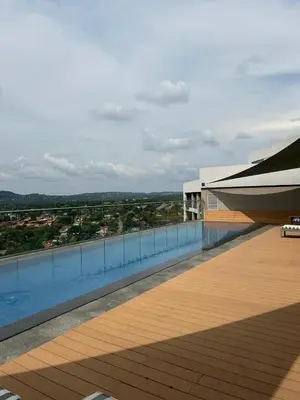 a building with a pool and a boat on the roof at Menlyn Main Apartments Trilogy in Pretoria