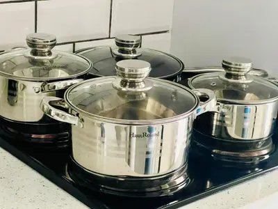 a group of pots and pans sitting on a stove at Loft On Grosvenor in Pretoria