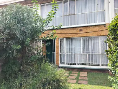 a brick house with a door and windows at Rhodesfield's Hidden Gem in Kempton Park