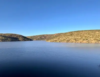 a view of a lake with hills in the background at Fish Eagle Manor in Warmbaths