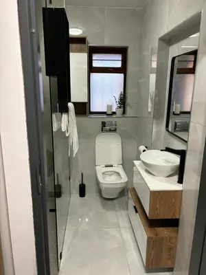 a bathroom with a toilet and a sink at 191 Protea Estate in Midrand