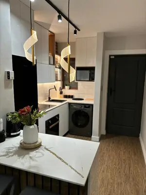 a kitchen with a white counter and a black door at 191 Protea Estate in Midrand