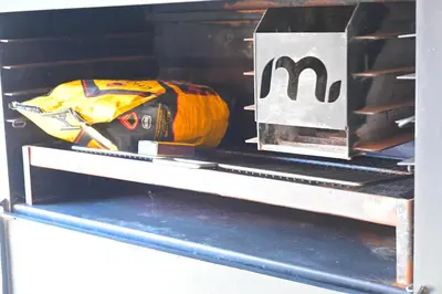 a box with a m on it sitting on a shelf at Sublime Home in Bela-Bela
