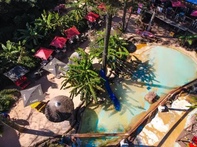 a large swimming pool in a resort with a resort at Beach Island Graskop in Graskop