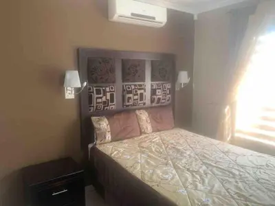 a bedroom with a bed in a room at Imani's Retreat in Midrand