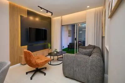 a living room with a couch and a tv at The Oasis, Unit N110 @ Glen Park in Pretoria