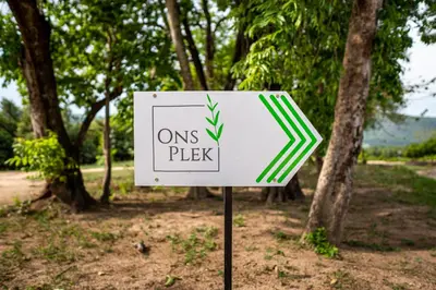 a sign that saysons pick in front of trees at Ons Plek Accommodation in Hazyview