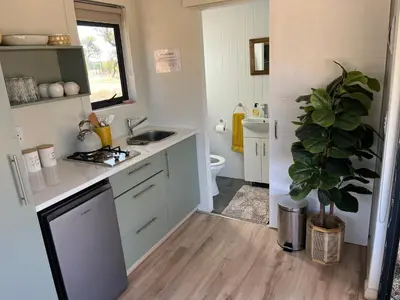 a small bathroom with a sink and a toilet at Paradise & Private Padel Court in Dinokeng Game Reserve in Hammanskraal