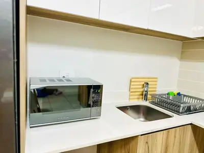 a kitchen counter with a microwave and a sink at Beach-Style Bliss at The Blyde in Pretoria