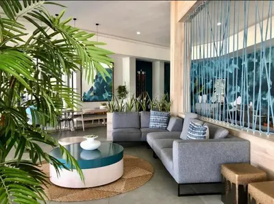 a living room with a couch and a table at Beach-Style Bliss at The Blyde in Pretoria