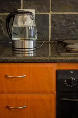 a tea kettle on a counter in a kitchen at Midrand Cozy in Midrand