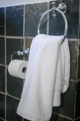 a towel rack with a roll of toilet paper at Midrand Cozy in Midrand