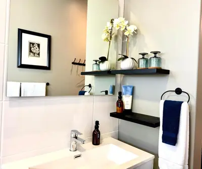 a bathroom with a sink and a mirror at IBella's at The Urban in Pretoria