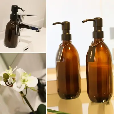 a bottle of soap and a flower on a table at IBella's at The Urban in Pretoria