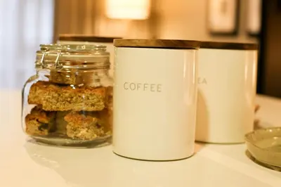 a table with two jars of coffee on it at IBella's at The Urban in Pretoria