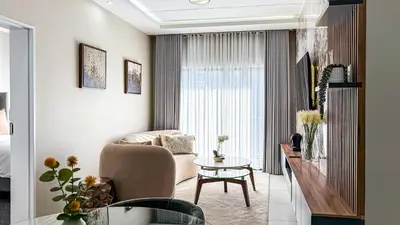 a living room with a couch and a table at Thetan's Home Away From Home in Midrand