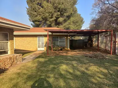 a covered patio in the backyard of a house at House at Bethesda in Springs