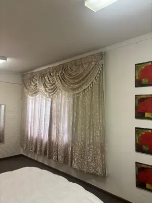 a bedroom with a bed and a window at Load shedding free studio apartment in Pretoria