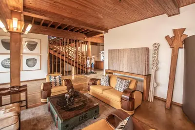 a living room with a couch and a table at Graskop Hotel in Graskop