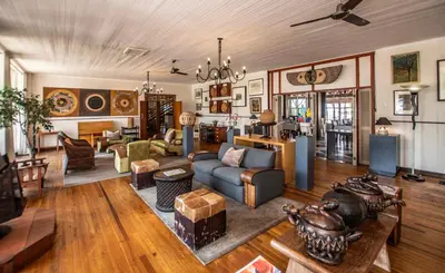 a living room with a couch and a table at Graskop Hotel in Graskop