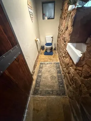 a bathroom with a toilet and a sink at Goldeneye Chalet -Hidden Gem of Hartees in Hartbeespoort