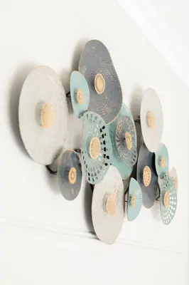 a bunch of plates hanging on a wall at The African Penguin Guesthouse in Pretoria