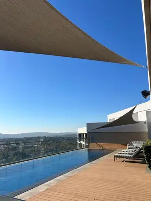 a view from the roof of a building with a swimming pool at Trilogy Cozy Studio in Pretoria
