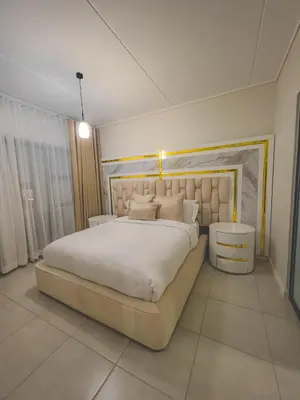 a bedroom with a large white bed in a room at The Blyde 3bed Beach Facing F&S Luxurious 2 in Pretoria