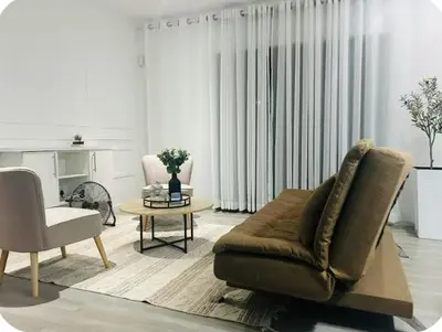 a living room with a couch and a table at 4beds,3 bedrooms,Braai,Full kitchen in Tzaneen