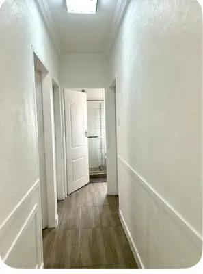 an empty room with a door and a hallway at 4beds,3 bedrooms,Braai,Full kitchen in Tzaneen