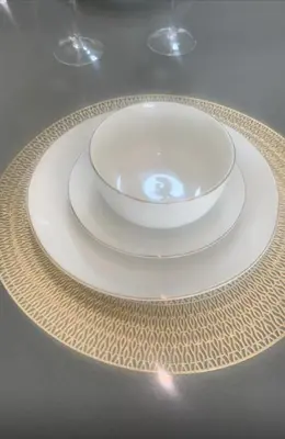 a plate with a bowl on top of a table at 273OnNew Road in Midrand