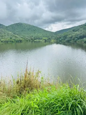 a body of water with mountains in the background at Mabalingwe Mistykie Lodge in Warmbaths