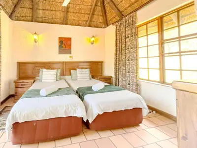 a bedroom with two beds in a room at Mabalingwe Mistykie Lodge in Warmbaths