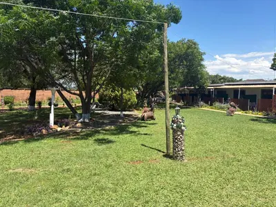 a fire hydrant in the middle of a yard at Remi's Boutique Lodge & SPA in Pretoria