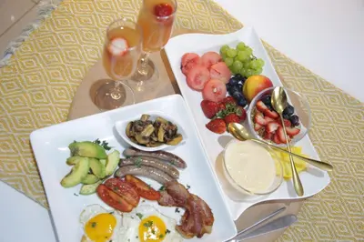a tray of breakfast foods on a table at The Village GuestHouse in Acornhoek
