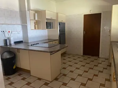 a kitchen with a counter top and a refrigerator at Lynnwood 246 House in Pretoria