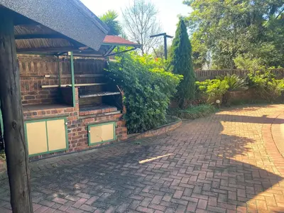a brick house with a brick driveway at Lynnwood 246 House in Pretoria