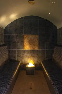 a room with two beds and a fire in the corner at Thaba Bolayi Private Nature Reserve in Musina