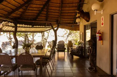 a dining room with a table and chairs at Thaba Bolayi Private Nature Reserve in Musina