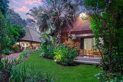 a house with a green lawn in front of it at Spurflower in Tzaneen