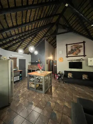 a large kitchen with a table in a room at 2694 Marloth Park Family Villa in Marloth Park