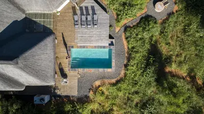an overhead view of a house with a swimming pool at Villa Blaaskans in Hoedspruit