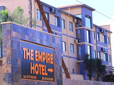 a hotel sign in front of a building at The Empire Hotel in Vendaland