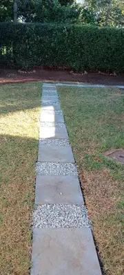 a stepping stone path in the grass in a garden at Villa paradiso 1 in Centurion